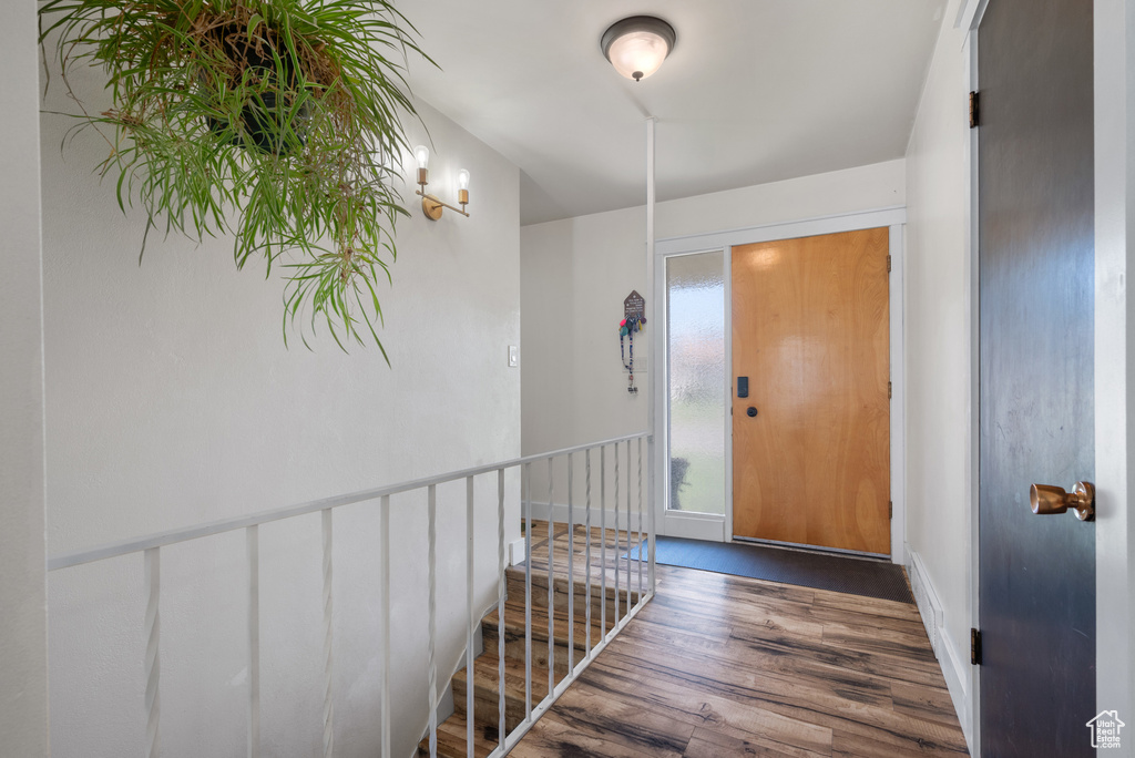 Entrance foyer with wood finished floors