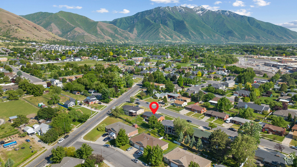 View of property location with mountains and nearby suburban area