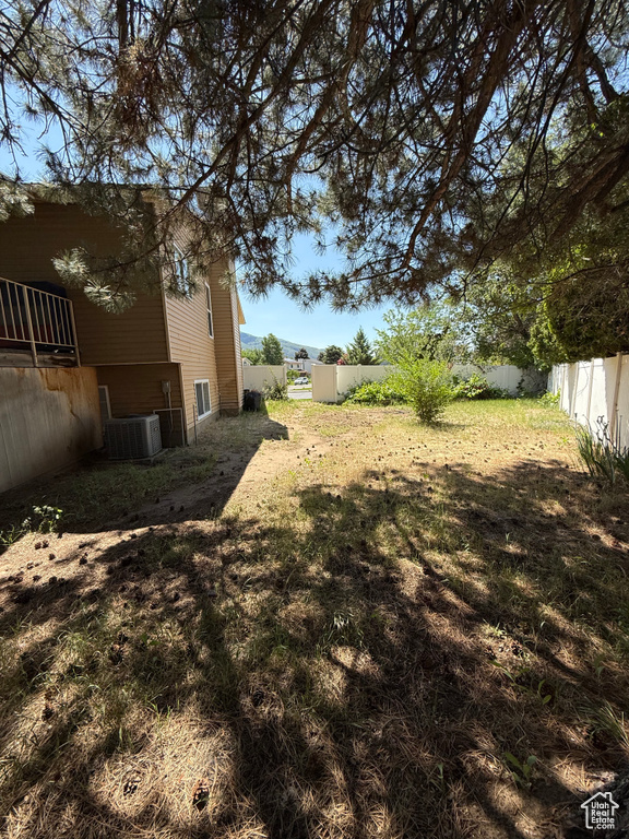 View of yard with central AC unit