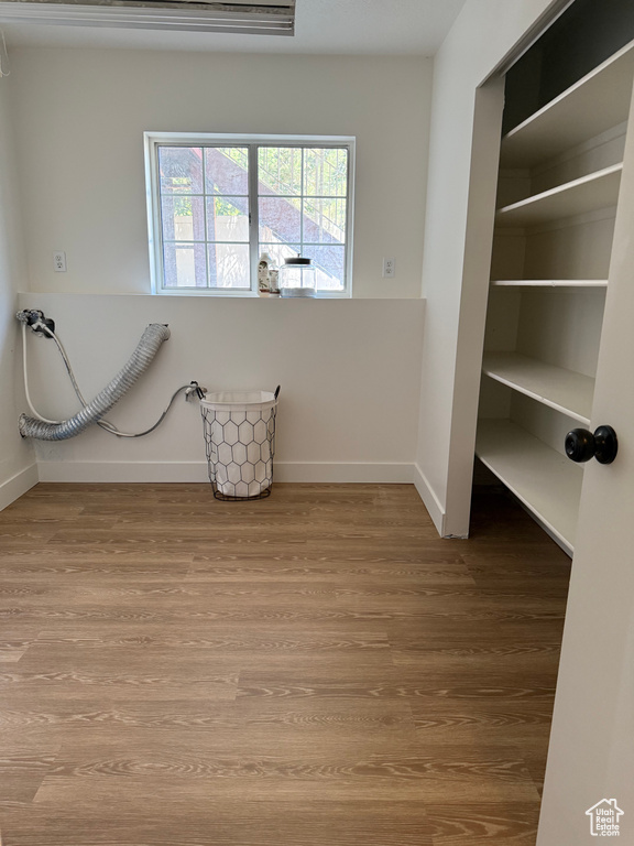 Interior space featuring wood finished floors and baseboards