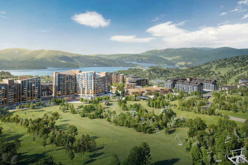 Aerial view of property\'s location featuring a water and mountain view and apartment complex