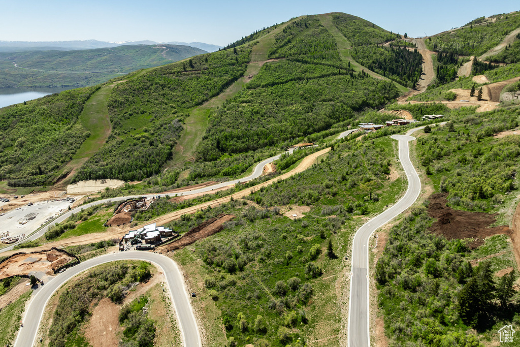 View of property location featuring a water and mountain view