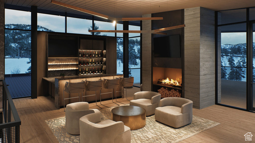 Building lobby featuring expansive windows and wood ceiling