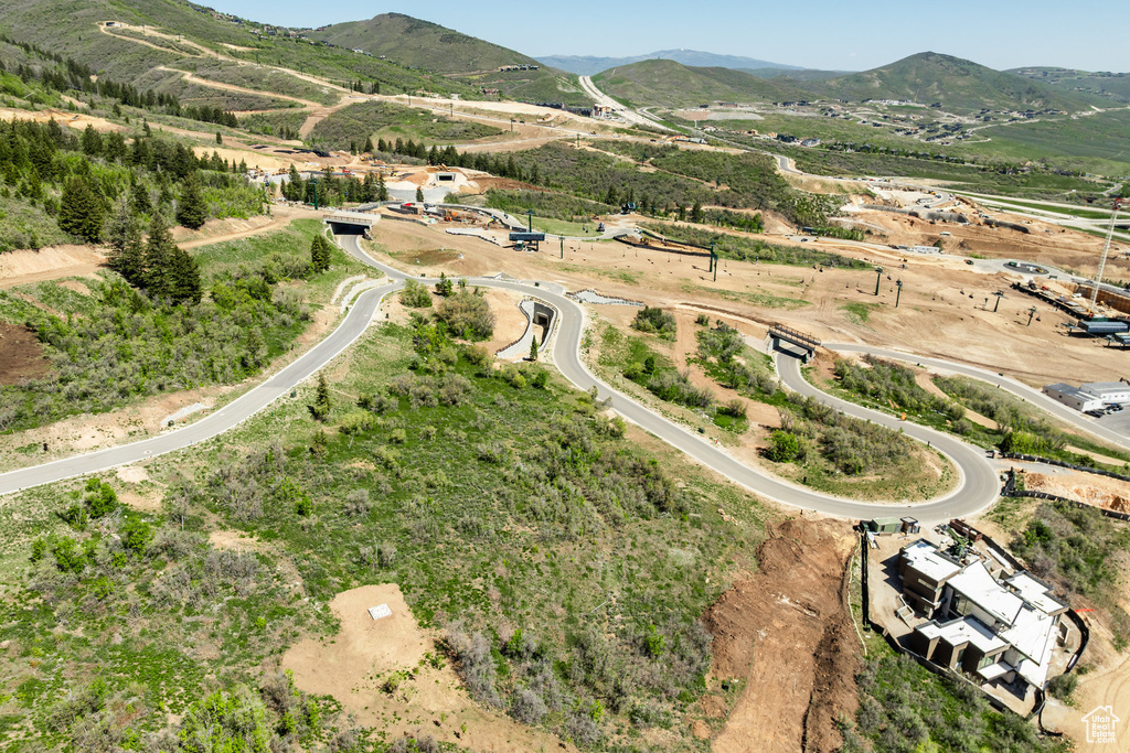 Aerial view of property\'s location featuring a mountainous background