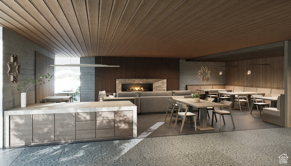 Reception area featuring wooden walls, wooden ceiling, and a premium fireplace