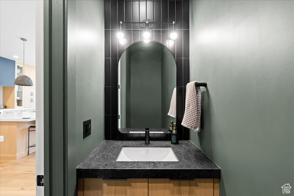 Bathroom with vanity and wood finished floors