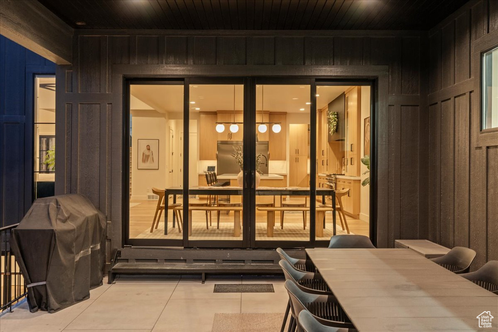 View of patio / terrace with area for grilling, outdoor dining area, french doors, and a sink
