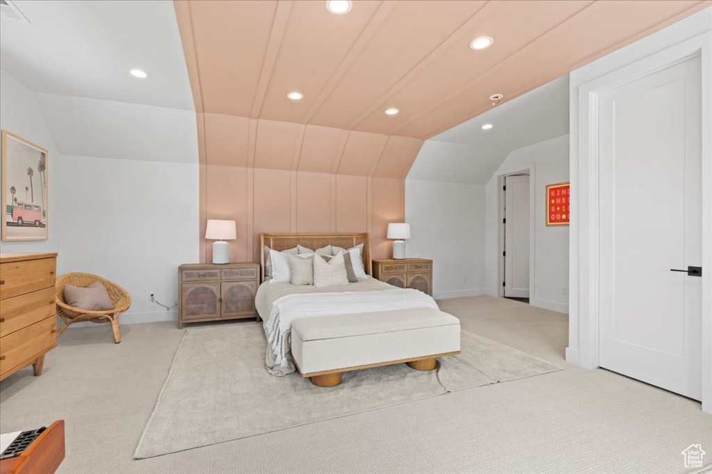 Bedroom featuring light colored carpet, vaulted ceiling, recessed lighting, and baseboards