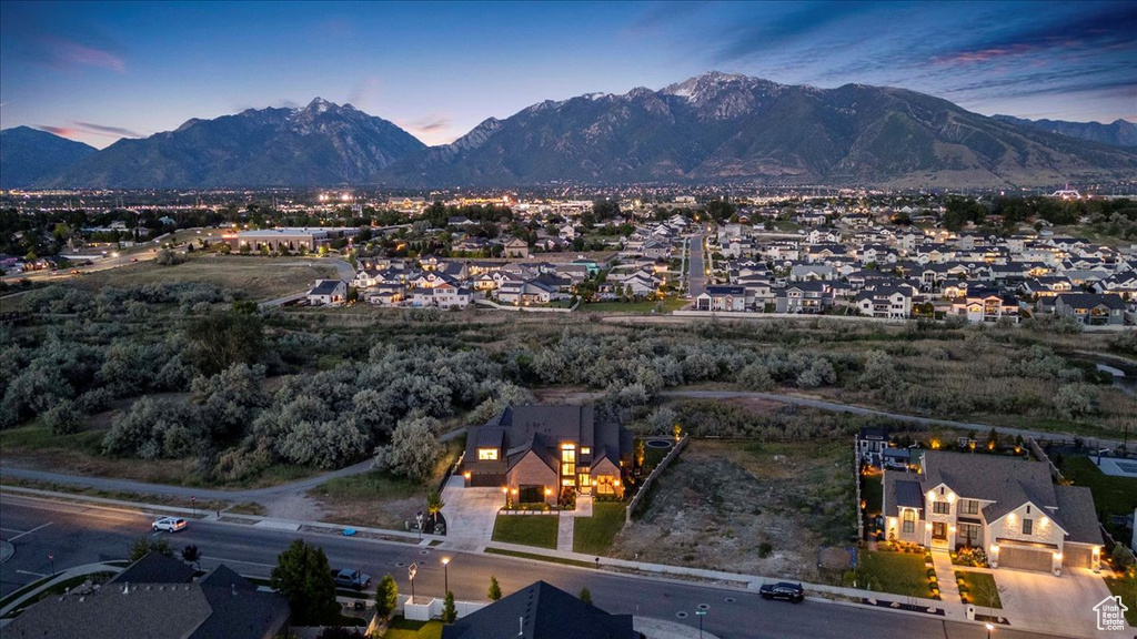 View of mountain backdrop featuring nearby suburban area