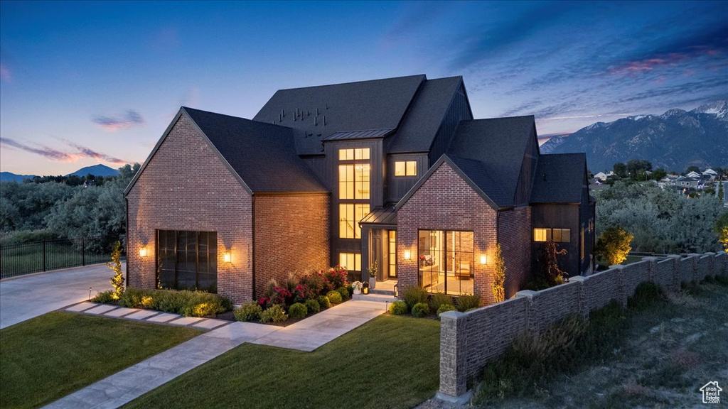 View of front facade featuring brick siding and a mountain view