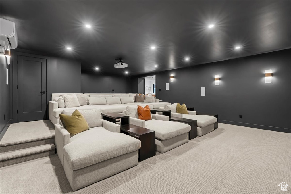 Cinema room with carpet flooring, recessed lighting, a wall mounted AC, and baseboards