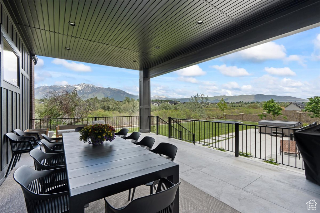 View of patio / terrace with a mountain view and outdoor dining space