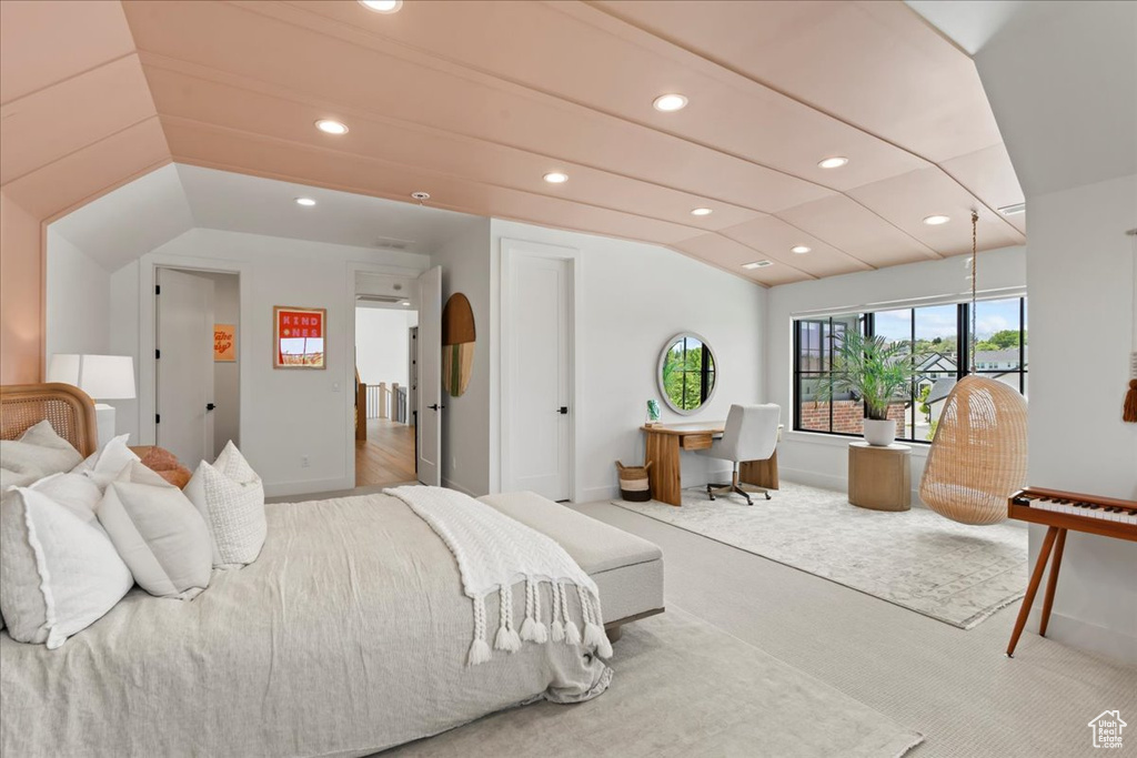 Carpeted bedroom featuring vaulted ceiling, baseboards, and recessed lighting
