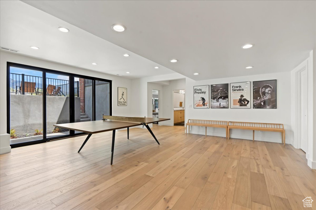 Recreation room featuring light wood-type flooring and recessed lighting