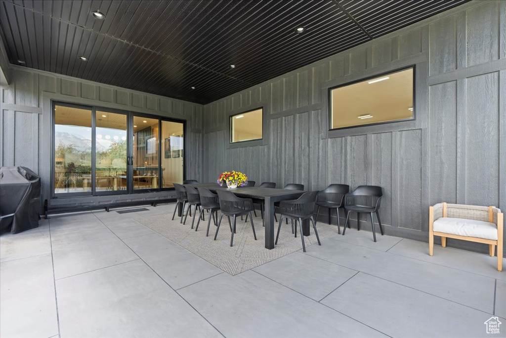 View of patio featuring grilling area and outdoor dining area