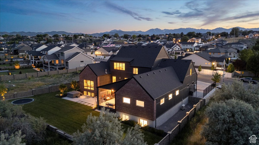 Aerial perspective of suburban area featuring a mountainous background