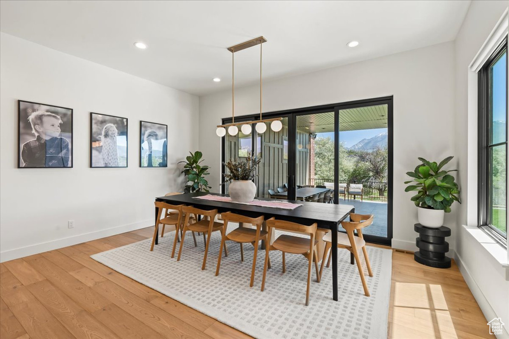 Dining space with light wood-type flooring, recessed lighting, and baseboards