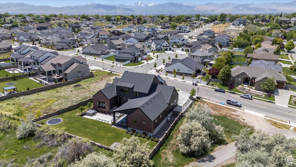 Aerial view of residential area featuring mountains