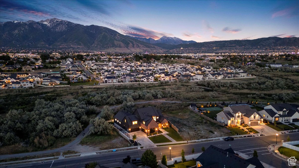 Aerial view of property\\\'s location featuring a mountainous background and nearby suburban area