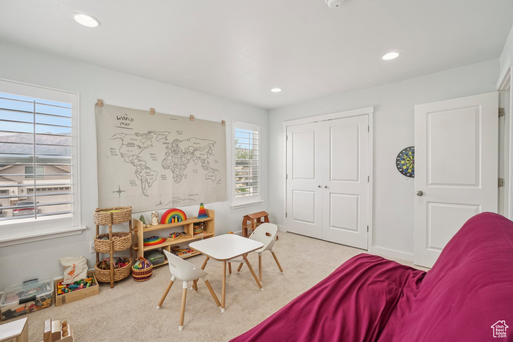 Playroom with carpet floors and recessed lighting