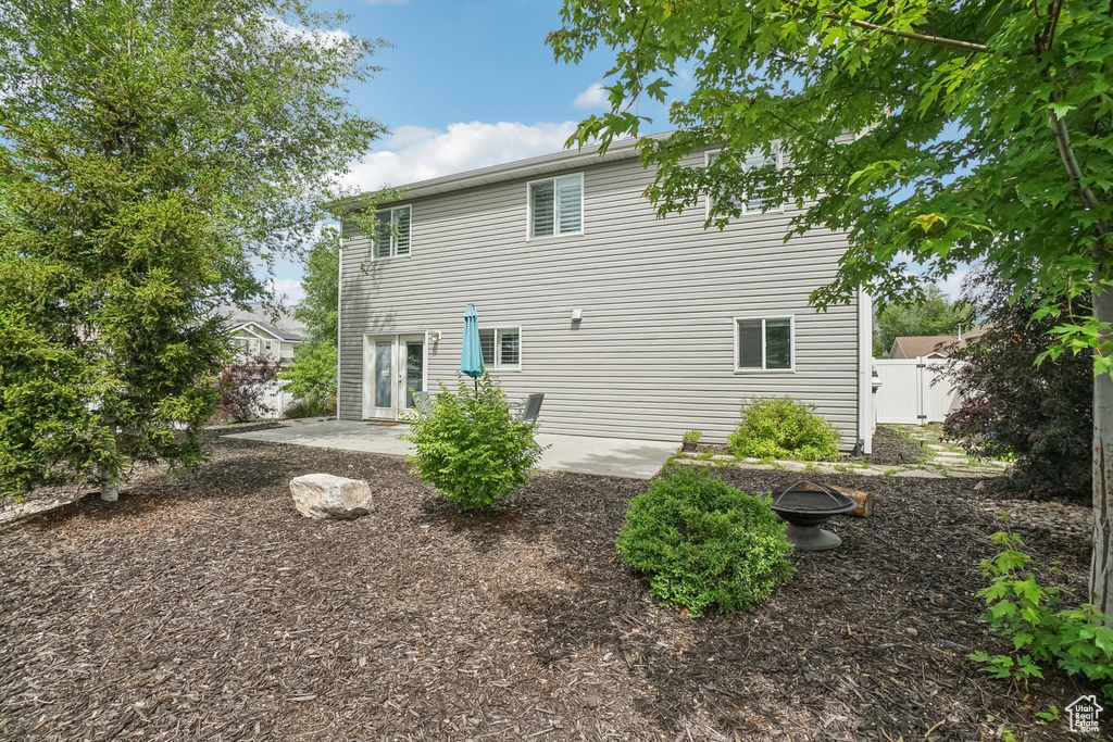 Rear view of property with a patio