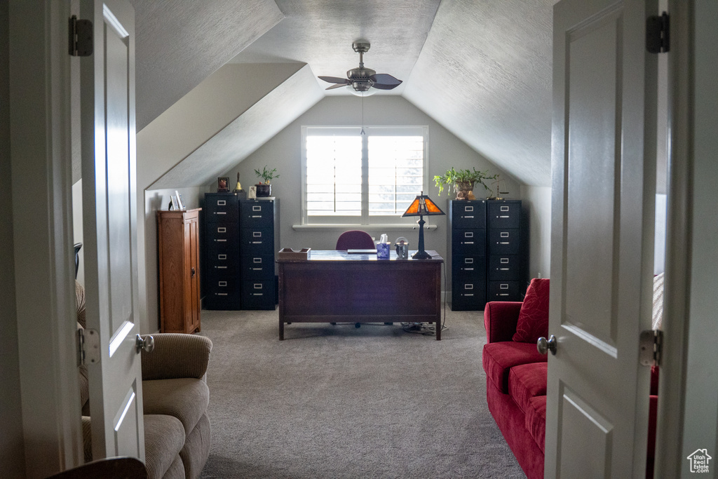 Office featuring carpet, lofted ceiling, a textured ceiling, and ceiling fan
