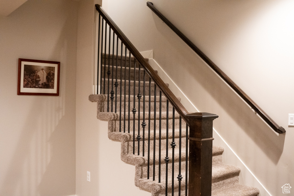 Stairway featuring baseboards