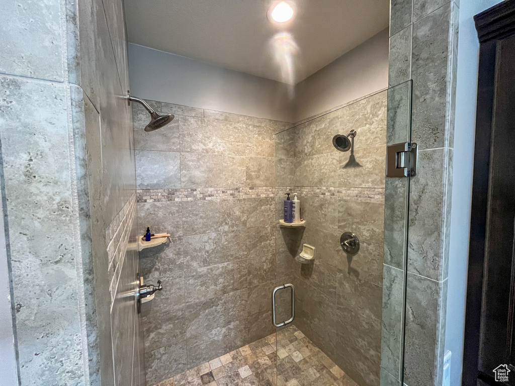 Full bath featuring a shower stall