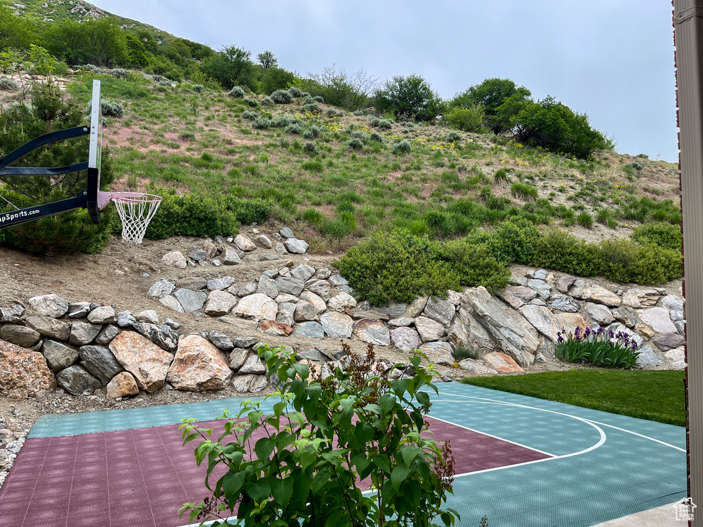 View of basketball court featuring basketball hoop