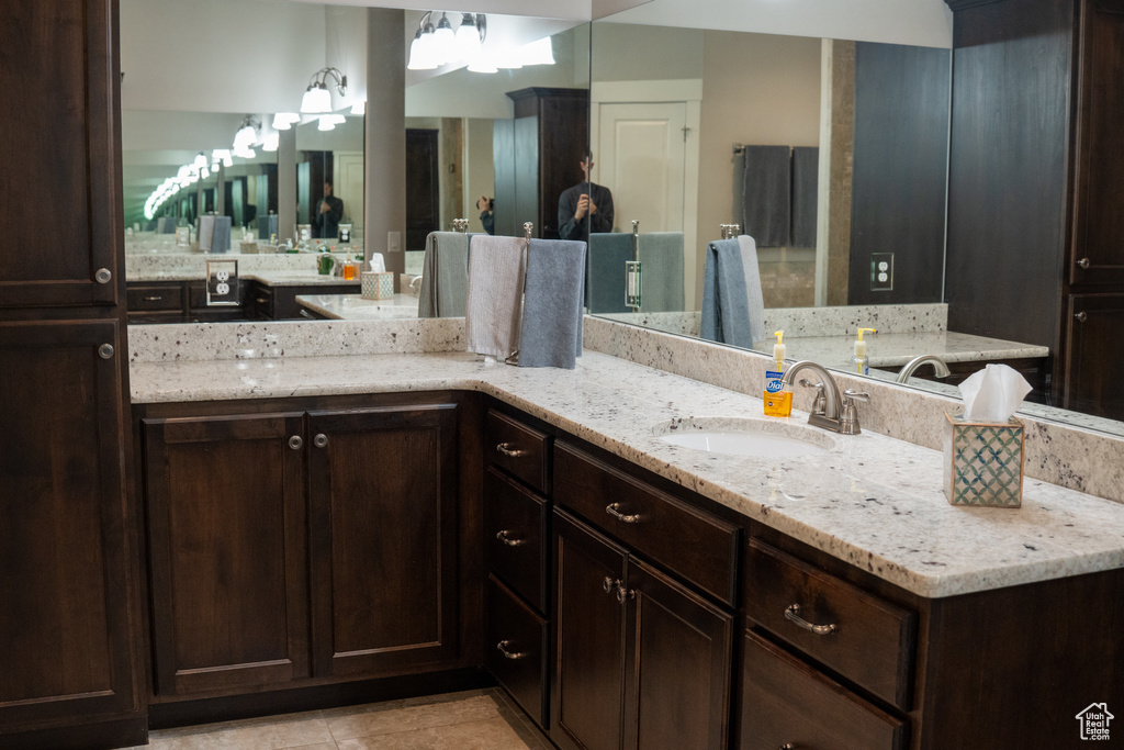 Bathroom with vanity and tile patterned flooring