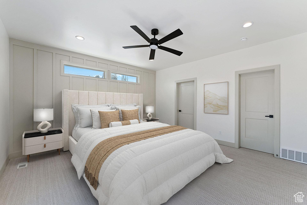 Bedroom with light carpet, baseboards, ceiling fan, and recessed lighting