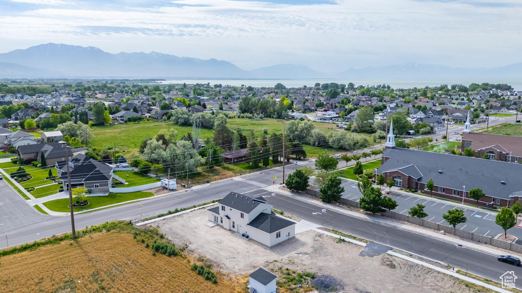Aerial perspective of suburban area with a mountainous background
