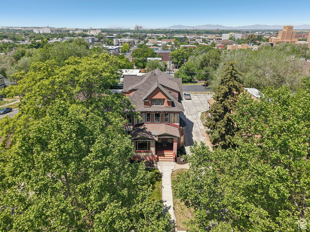 Aerial view of property and surrounding area with mountains