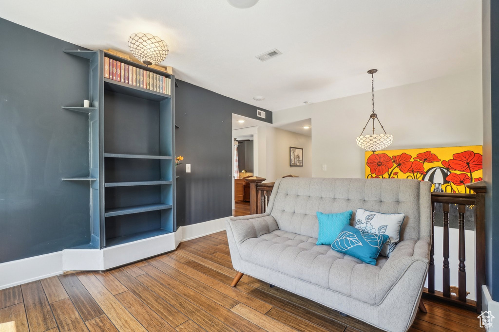 Living area featuring wood-type flooring and baseboards