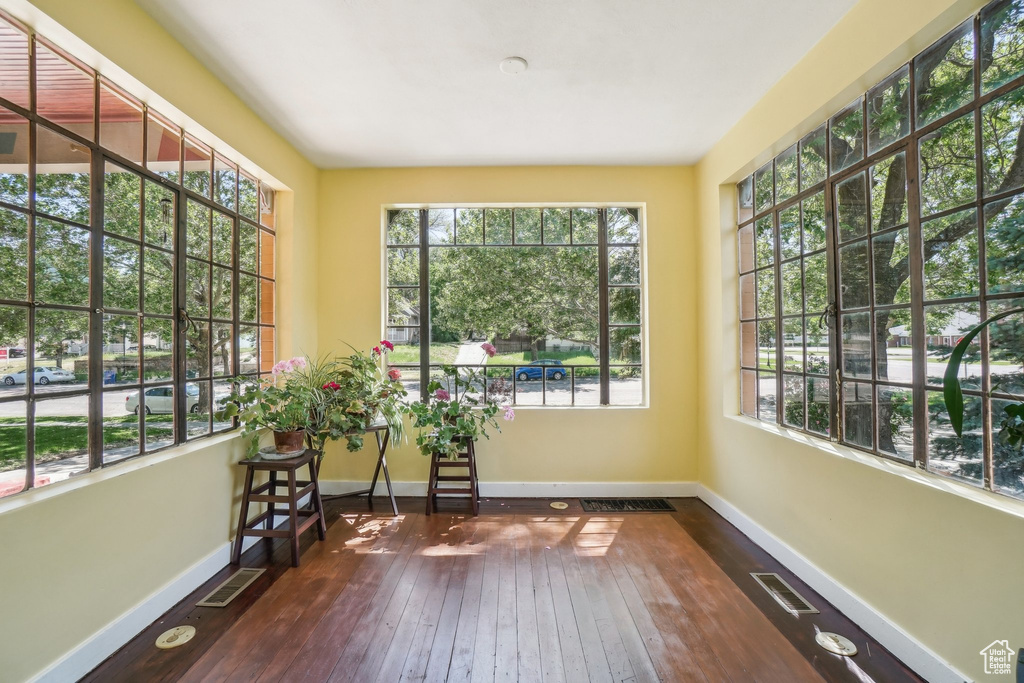 Unfurnished sunroom featuring healthy amount of natural light
