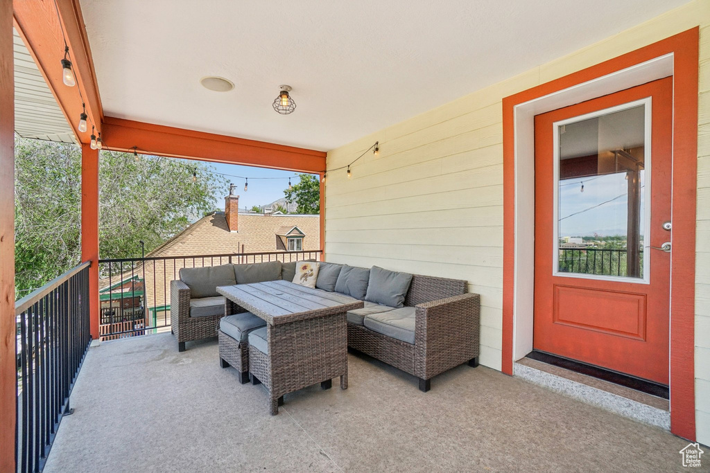 View of patio featuring a balcony and outdoor lounge area