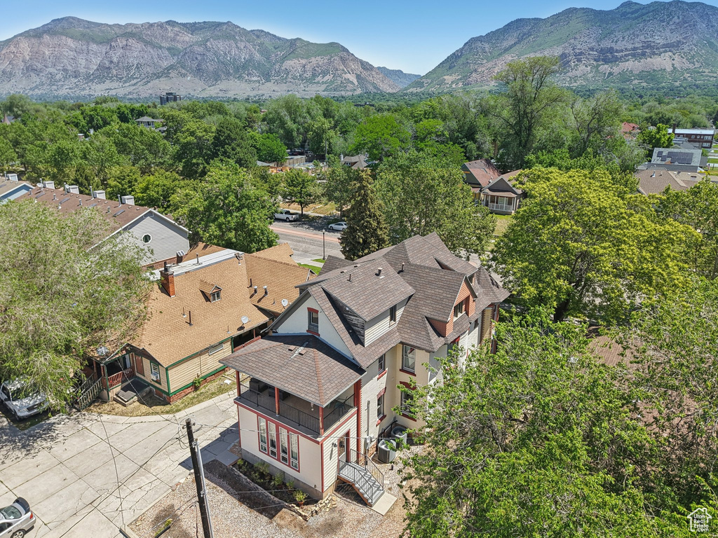 Aerial view of residential area featuring a mountainous background