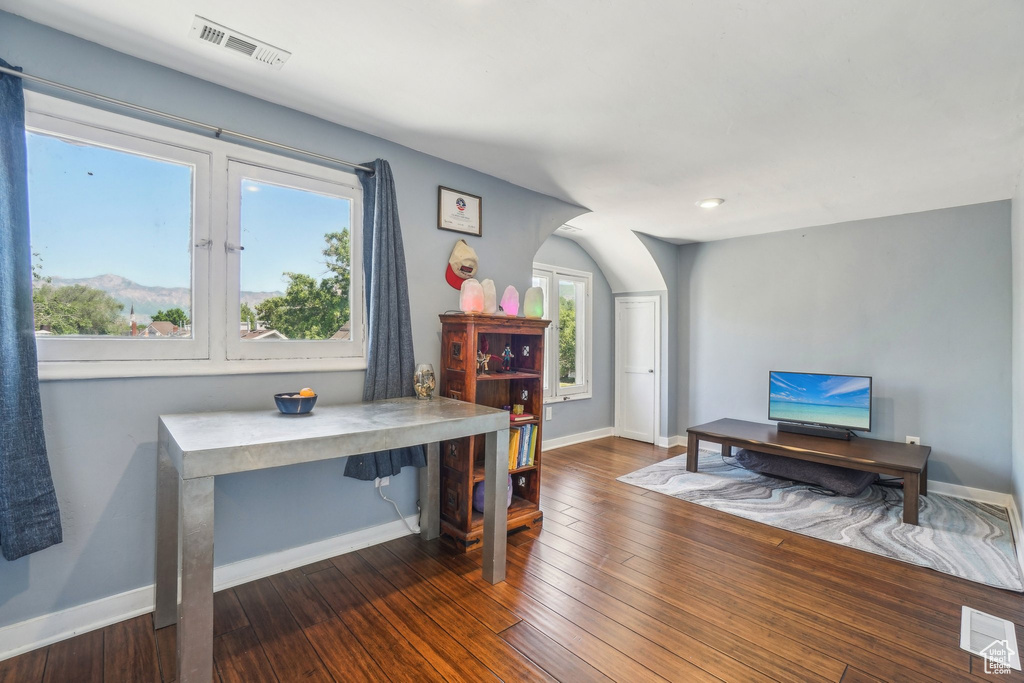 Home office featuring baseboards and wood finished floors