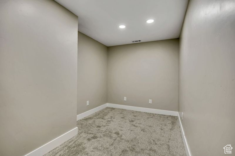 Unfurnished room featuring baseboards, recessed lighting, and carpet floors
