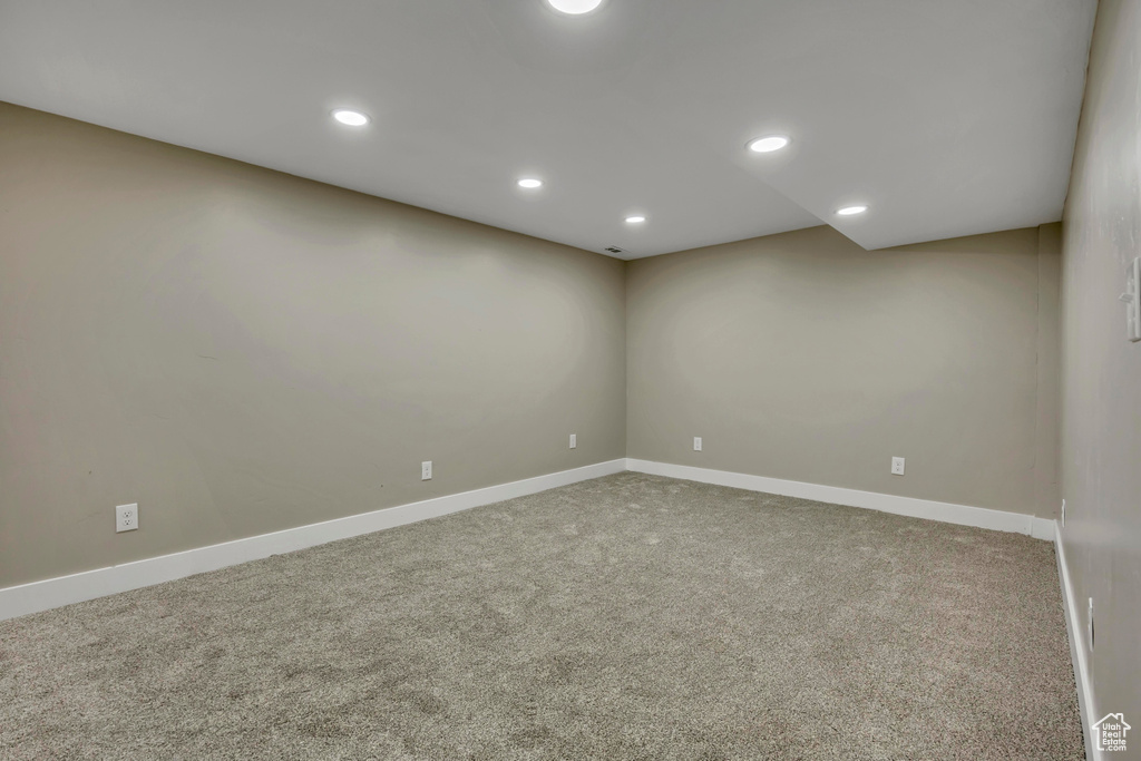 Empty room with carpet flooring, baseboards, and recessed lighting