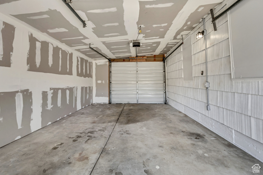 Garage featuring a garage door opener