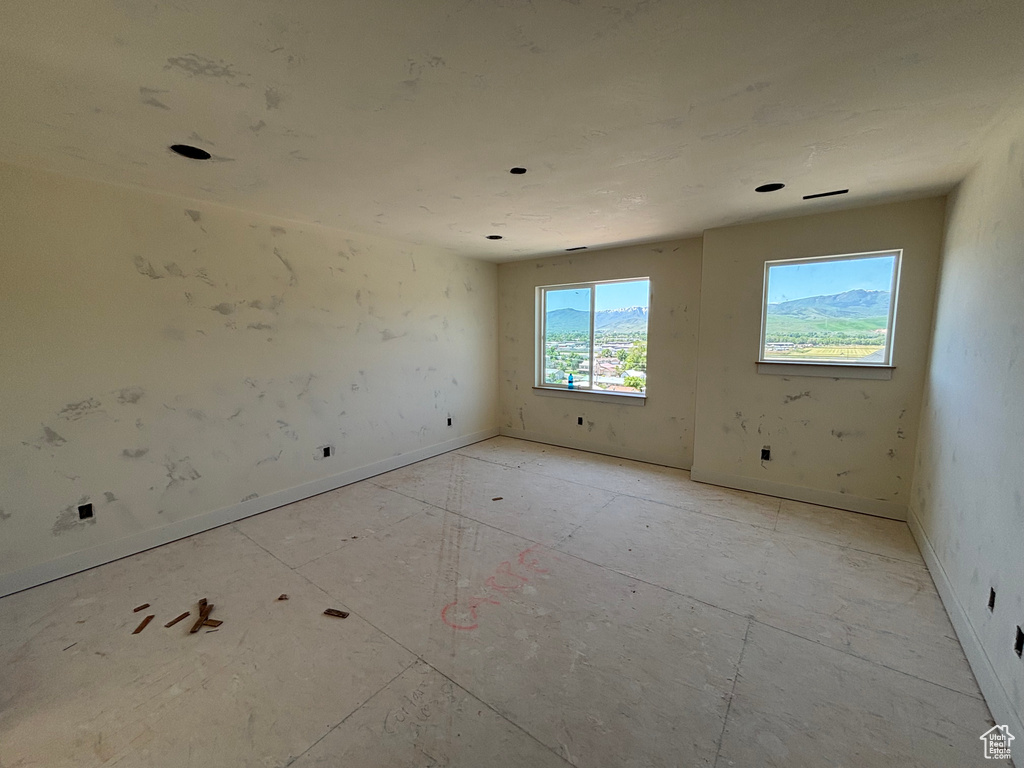 Unfurnished room featuring baseboards