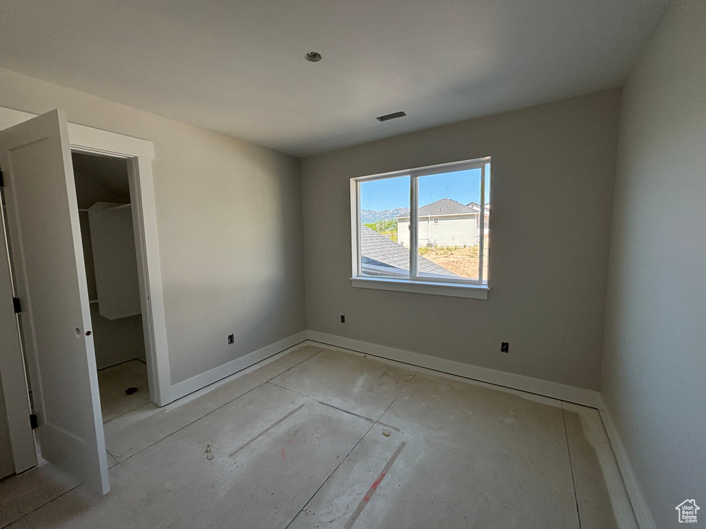 Unfurnished bedroom with baseboards