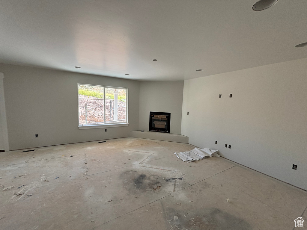 Unfurnished living room with a fireplace