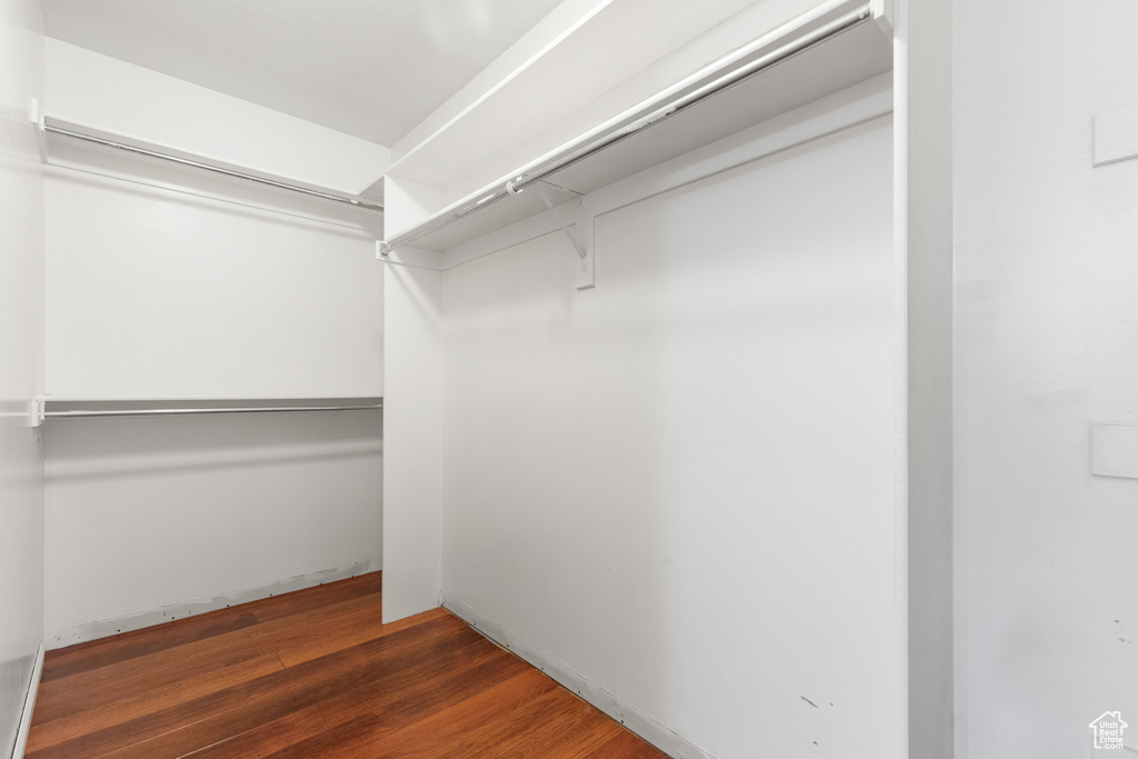 Spacious closet with wood finished floors