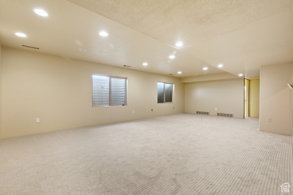 Unfurnished room featuring carpet and recessed lighting