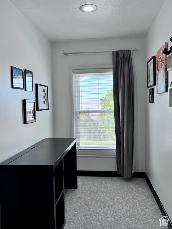 Unfurnished office featuring carpet flooring and baseboards