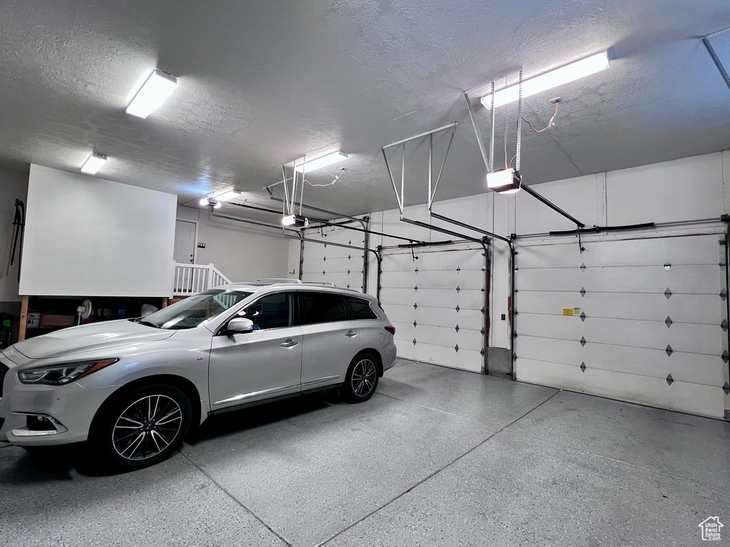 Garage featuring a garage door opener