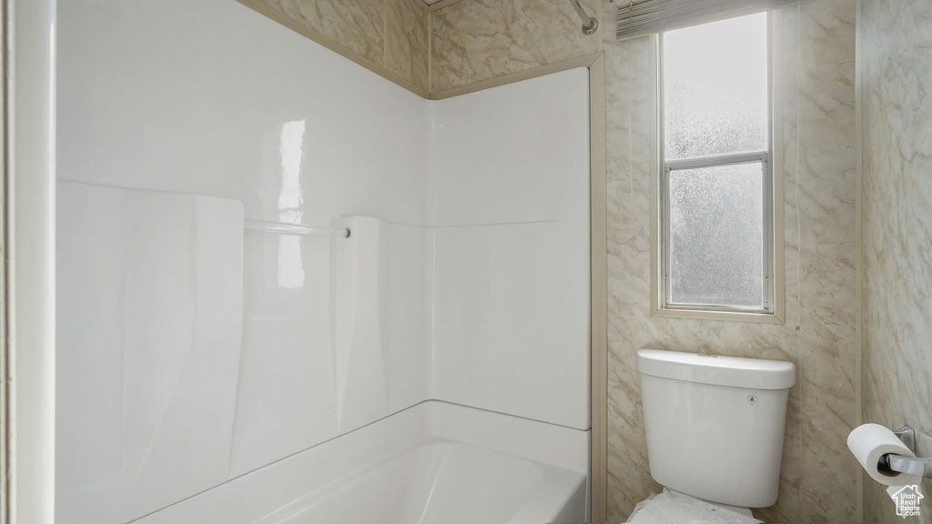 Bathroom with shower / bath combination and toilet