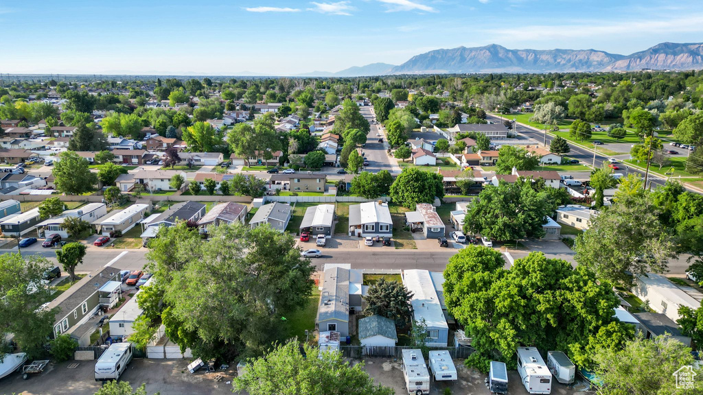 Aerial perspective of suburban area featuring a mountain backdrop